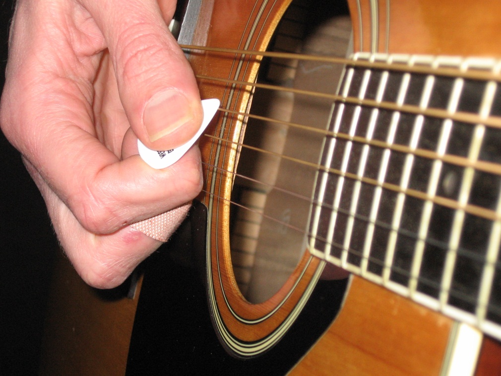 restringing a 12 string acoustic guitar